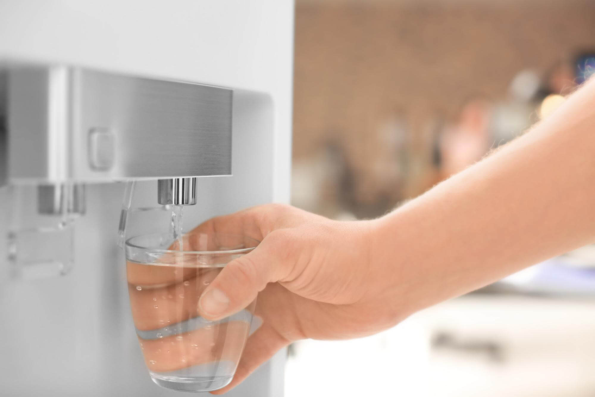 man-filling-glass-from-water-cooler-closeup (1)